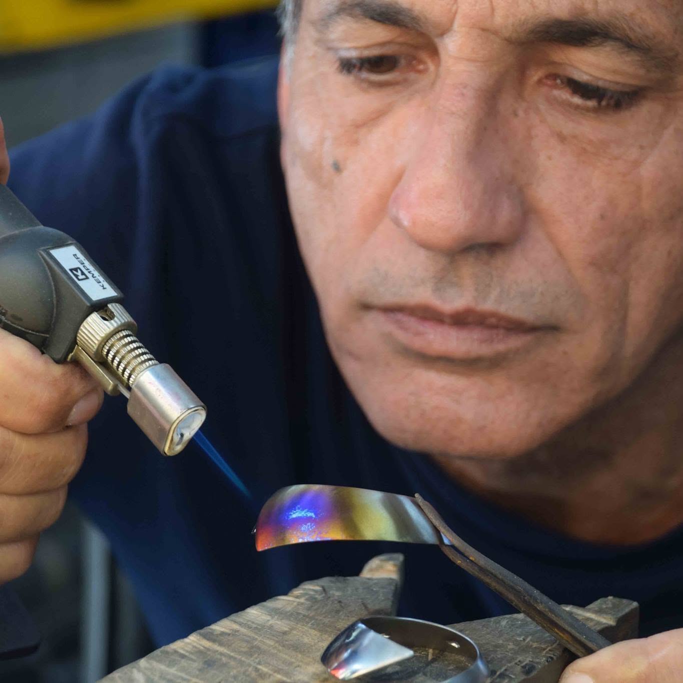 Jorge Gil applying heat coloration to titanium
