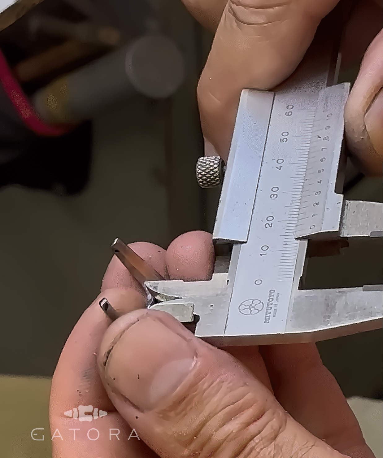 Measurement of the titanium buckle with caliper