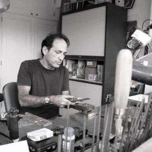 Jorge Gil holding an award object